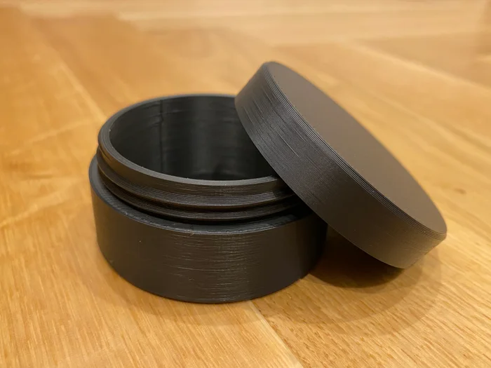 Parametric OpenSCAD Round Container Jar With Screw Lid, a preview image from Printables