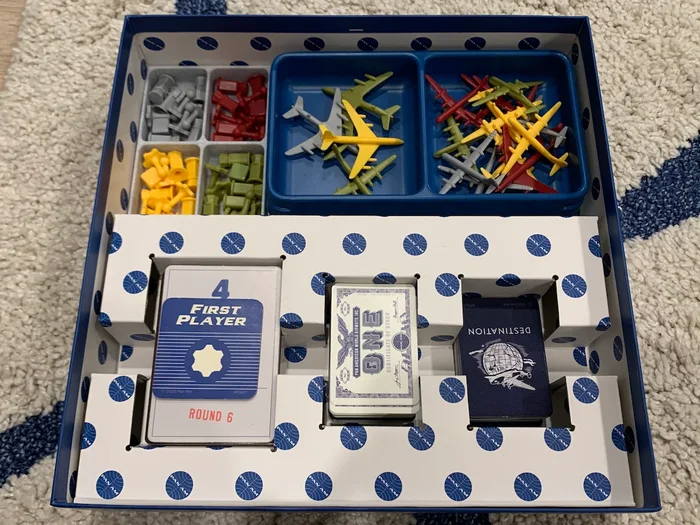 Pan Am Board Game Trays Insert and First Player Standee, a preview image from Thingiverse